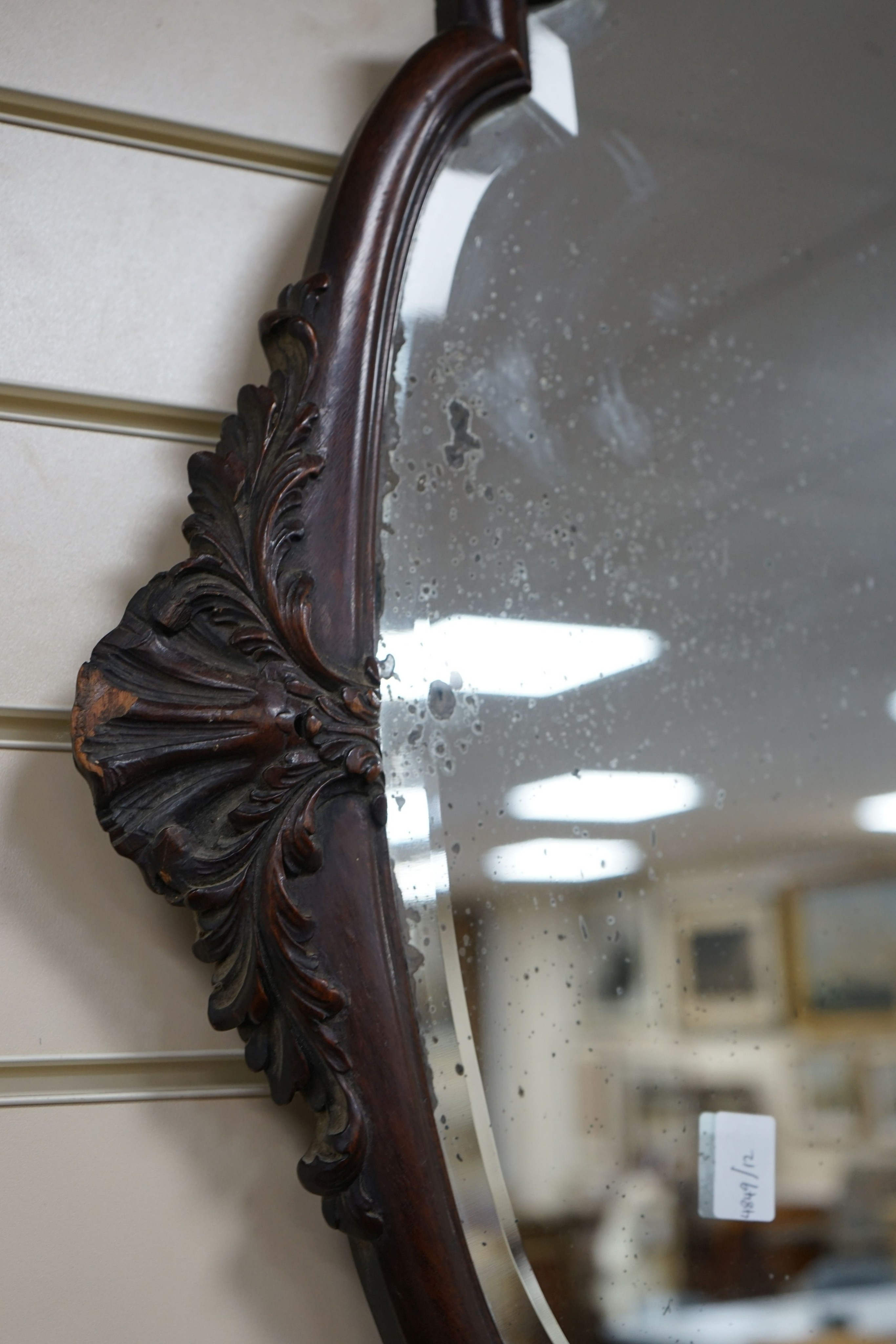 An early 20th century mahogany oval wall mirror, width 74cm, height 94cm